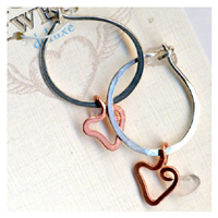 See larger view of these sterling and copper earrings by Susan Holstein Sterling and Copper Heart Earrings by Susan Holstein